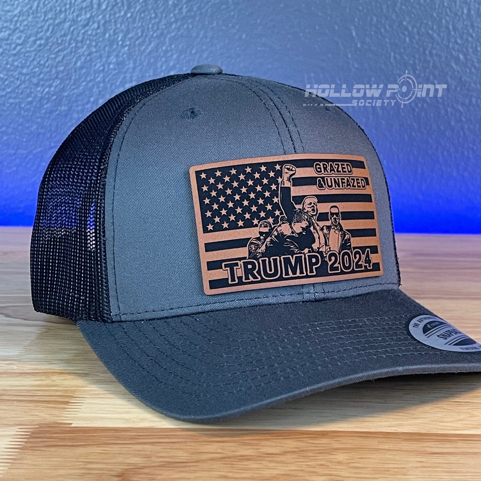 Grazed & Unfazed Trump 2024 SnapBack Trucker Rawhide Leather Flag Patch Charcoal Hat - Hollow Point Society - Patch Hat