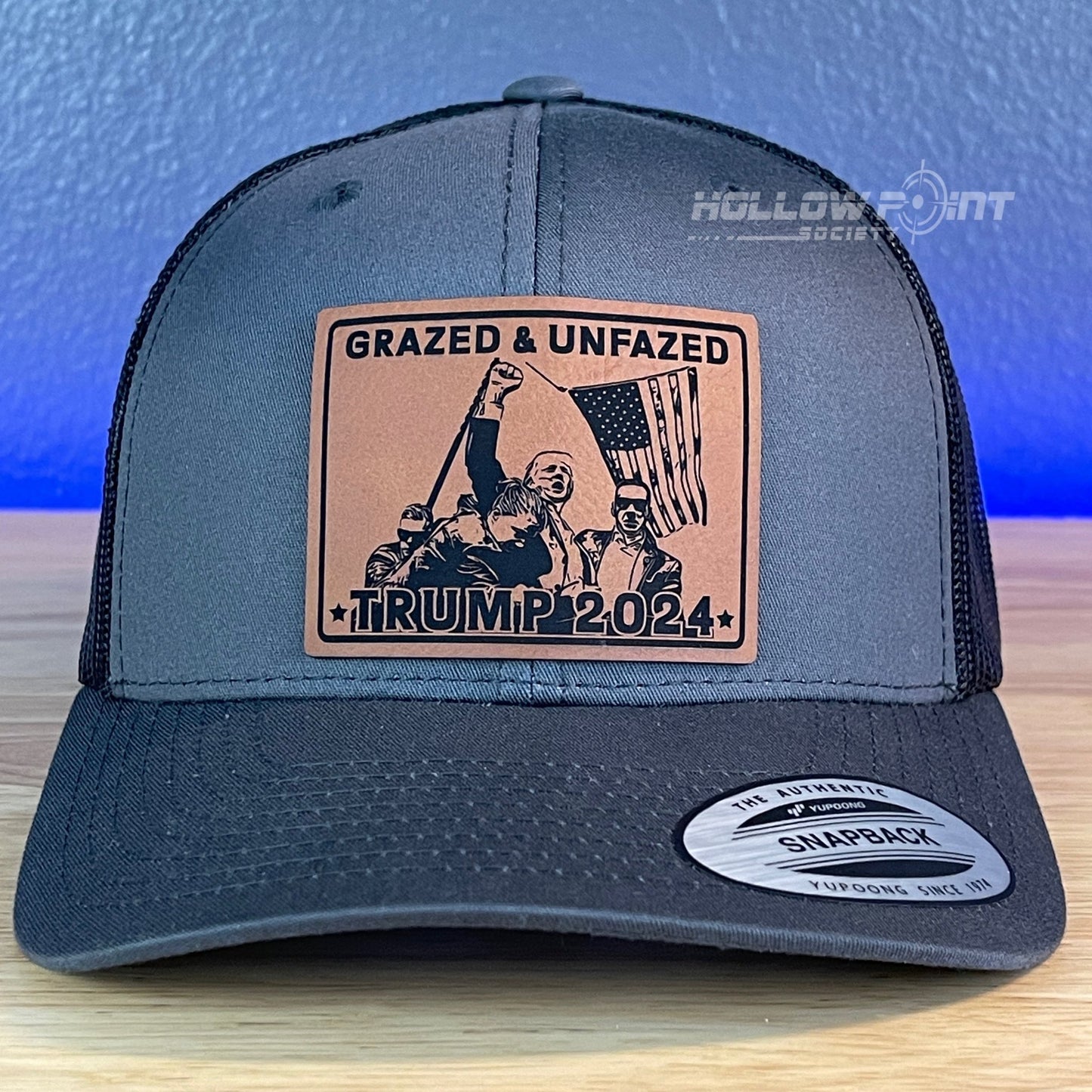 Grazed & Unfazed Trump 2024 SnapBack Trucker Rawhide Leather Patch Charcoal Hat - Hollow Point Society - Patch Hat