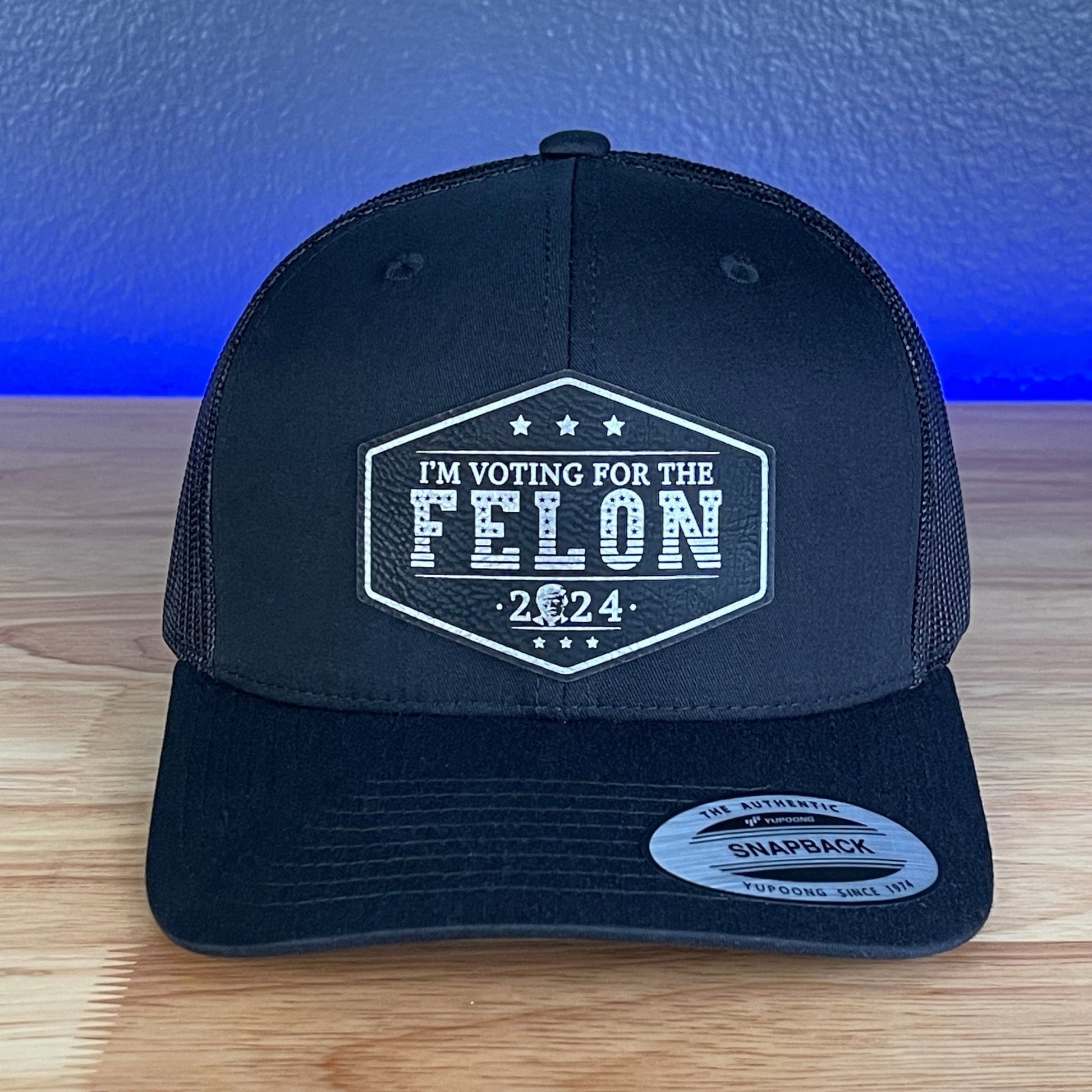 I'M VOTING FOR THE FELON Trump Face 2024 Leather Patch SnapBack Trucker Hat Black/Silver - Hollow Point Society - Patch Hat