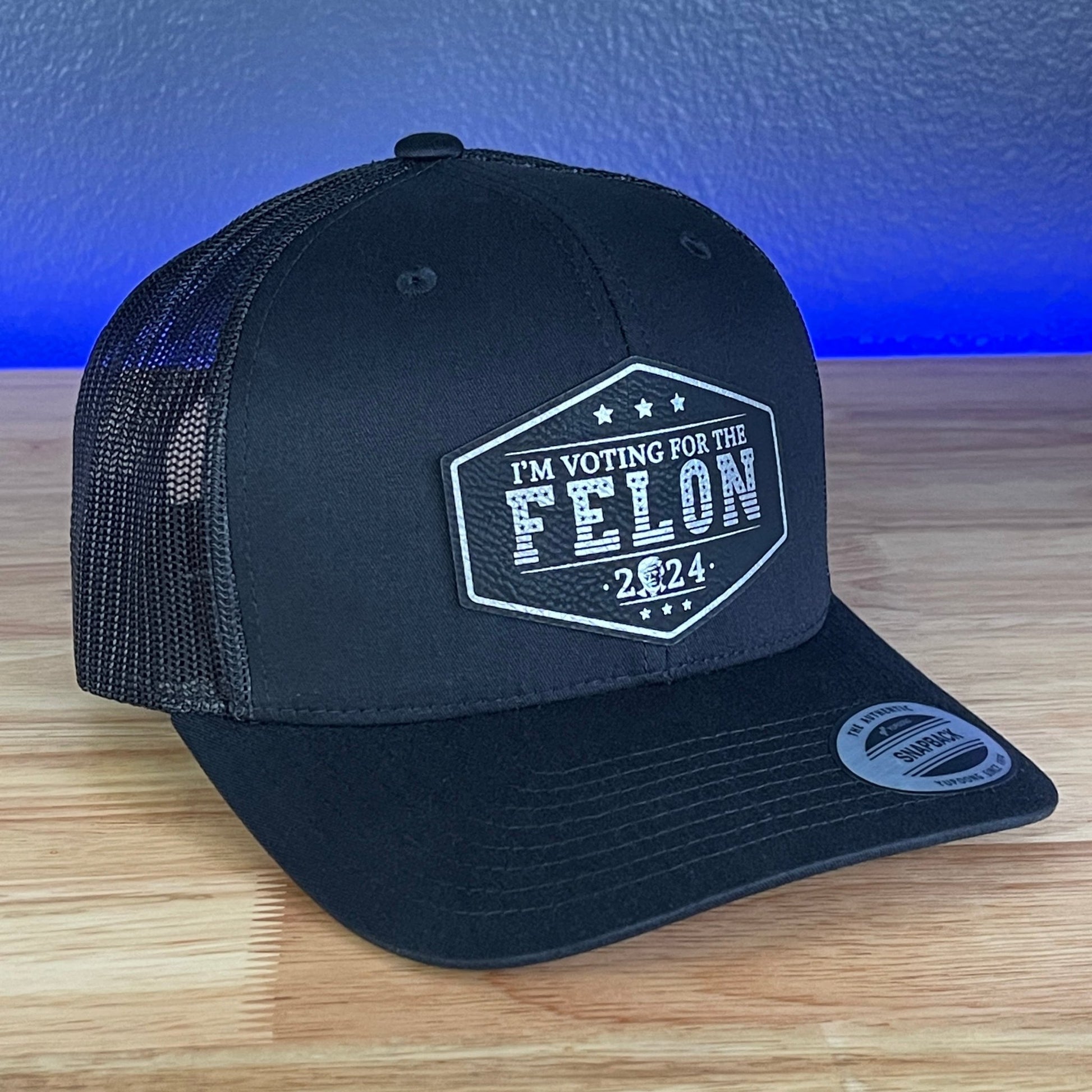 I'M VOTING FOR THE FELON Trump Face 2024 Leather Patch SnapBack Trucker Hat Black/Silver - Hollow Point Society - Patch Hat