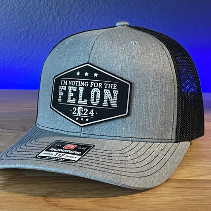 I'm Voting For The FELON Trump Face 2024 Trucker Hat Leather Patch Hat Black/Silver - Hollow Point Society - Patch Hat