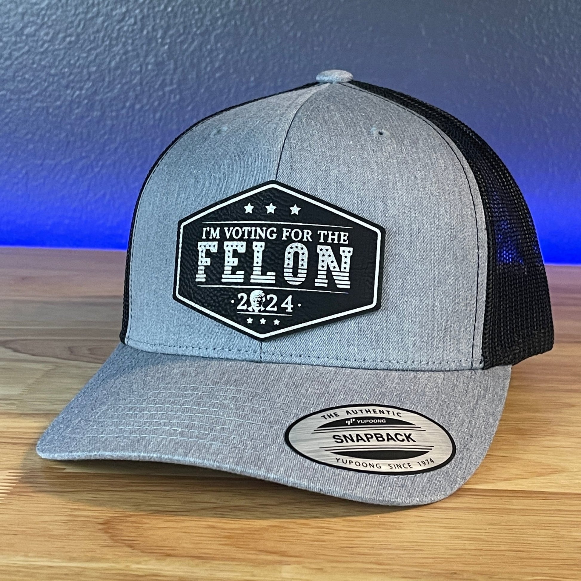 I'm Voting For The FELON Trump Face 2024 Trucker Hat Leather Patch Hat Black/Silver - Hollow Point Society - Patch Hat