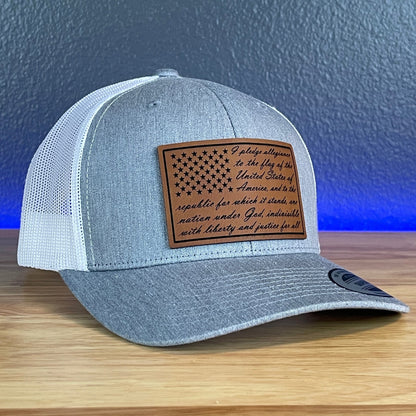 The Pledge Of Allegiance American Flag Patriotic Leather Patch Richardson Original 112 - or - Yupoong Classics 6606 SnapBack Trucker Hat Heather Grey/White - Hollow Point Society - Patch Hat