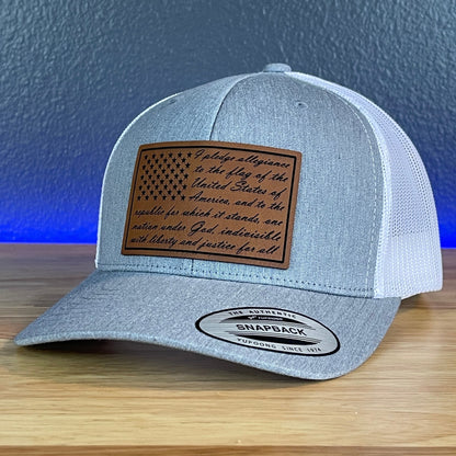 The Pledge Of Allegiance American Flag Patriotic Leather Patch Richardson Original 112 - or - Yupoong Classics 6606 SnapBack Trucker Hat Heather Grey/White - Hollow Point Society - Patch Hat